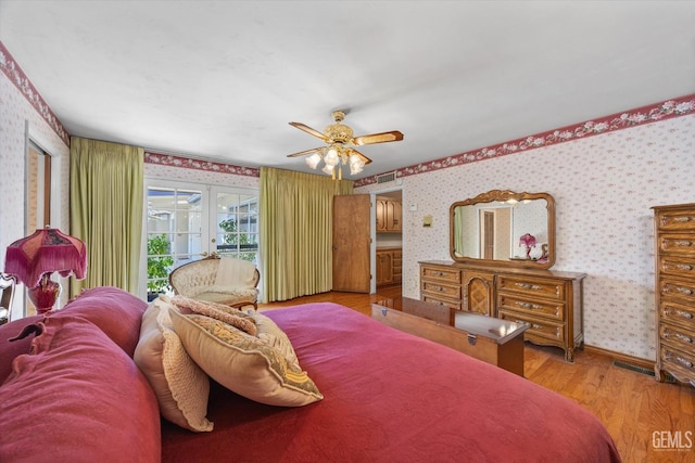 7858 Stine Rd, Bakersfield, CA 93313 - bedroom featuring french doors, access to outside, wallpapered walls, and wood finished floors