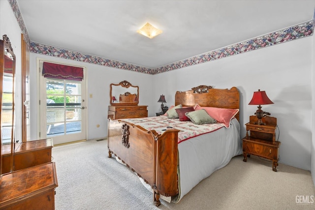 7858 Stine Rd, Bakersfield, CA 93313 - bedroom featuring access to outside, light carpet, and visible vents