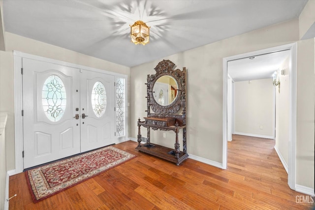 7858 Stine Rd, Bakersfield, CA 93313 - foyer featuring light wood-style flooring and baseboards