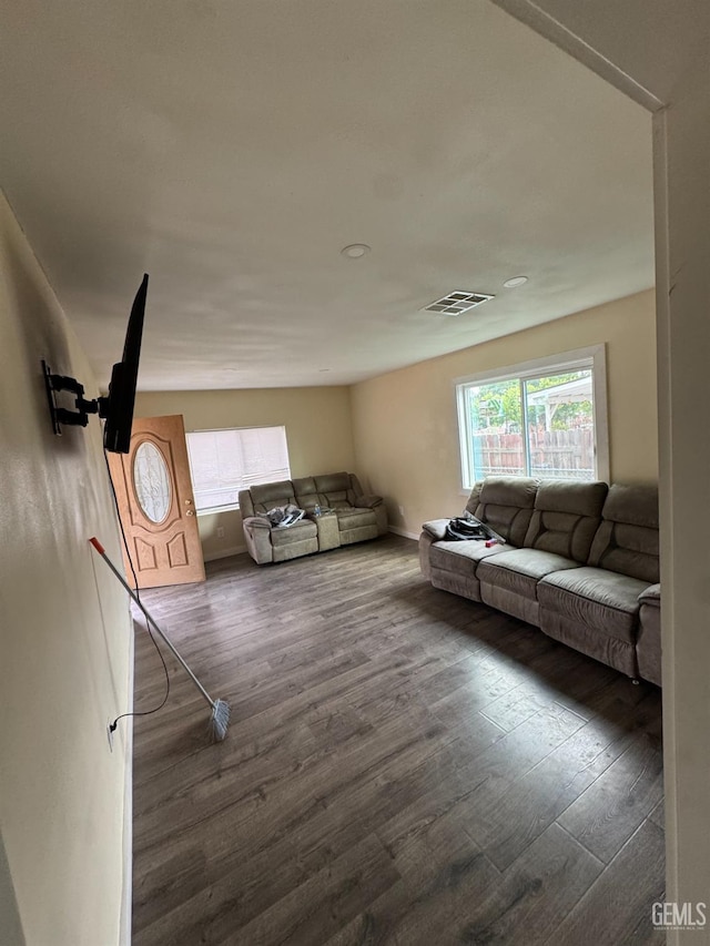 living room with visible vents and wood finished floors