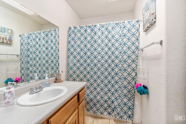 full bathroom with vanity and a shower with shower curtain