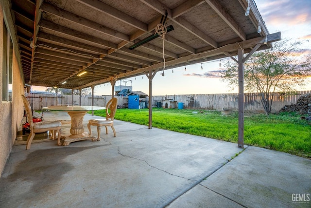 view of patio with a fenced backyard and outdoor dining space