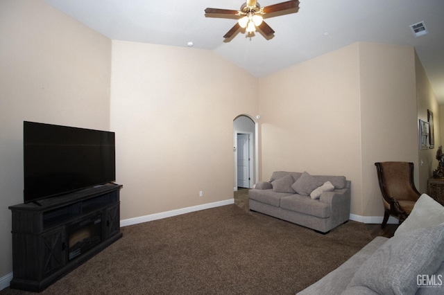 living room with dark colored carpet, ceiling fan, and lofted ceiling