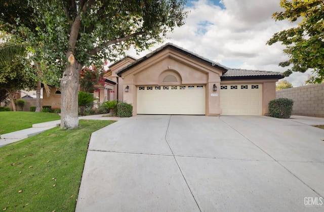 12504 Crown Crest Dr, Bakersfield, CA 93311 - view of front of property with an attached garage, stucco siding, a front yard, driveway, and a tile roof