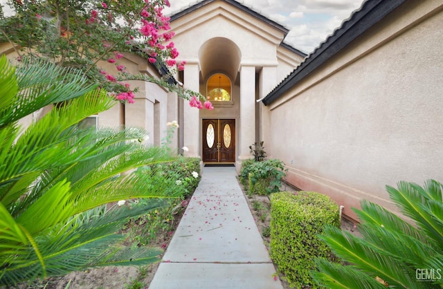 12504 Crown Crest Dr, Bakersfield, CA 93311 - entrance to property featuring stucco siding, french doors, and a tiled roof