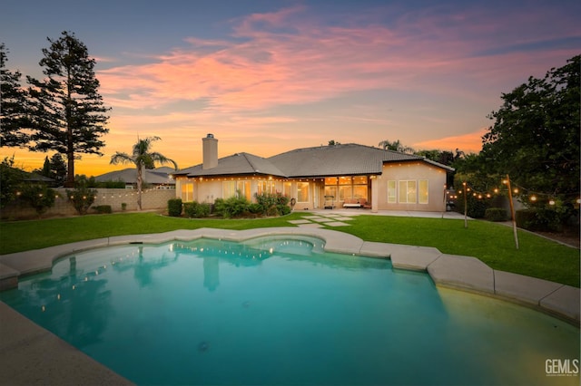 12504 Crown Crest Dr, Bakersfield, CA 93311 - pool at dusk featuring a patio area