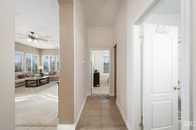 12504 Crown Crest Dr, Bakersfield, CA 93311 - corridor featuring light tile patterned floors and baseboards