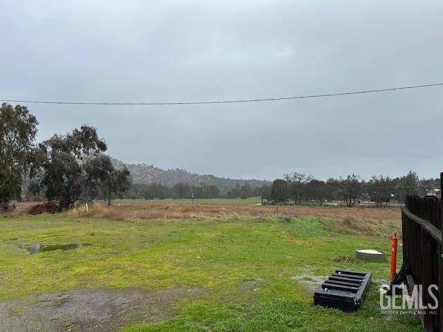 view of yard with a rural view