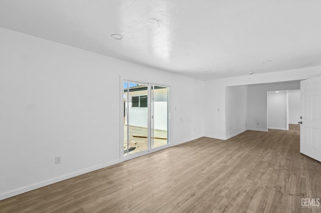 empty room with light hardwood / wood-style floors