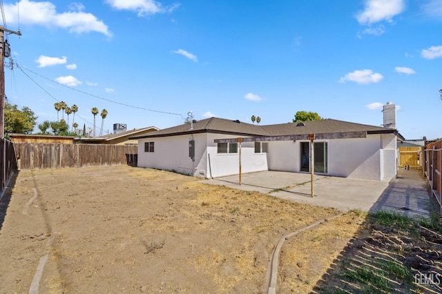 rear view of house featuring a patio