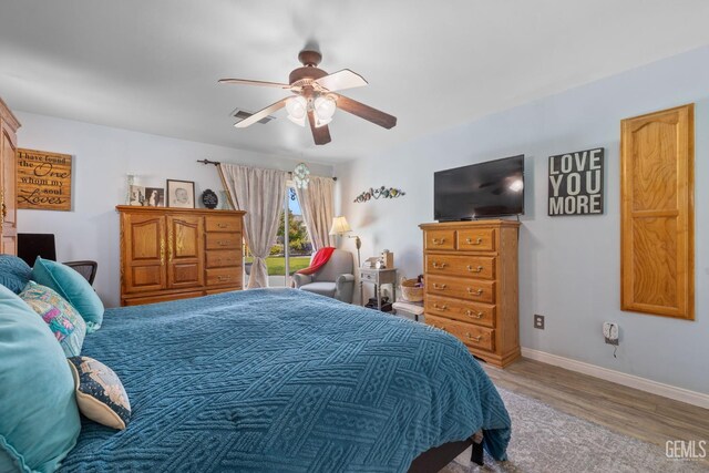 5512 Sicily Ct, Bakersfield, CA 93308 - bedroom featuring wood finished floors, baseboards, and a ceiling fan