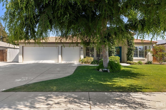 5512 Sicily Ct, Bakersfield, CA 93308 - obstructed view of property featuring concrete driveway, stucco siding, a tiled roof, and a garage