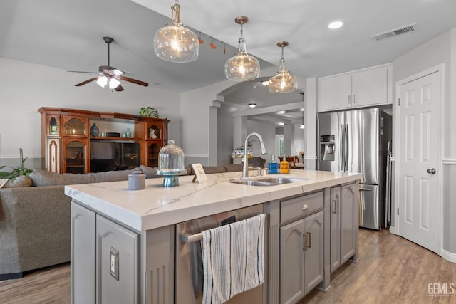 5512 Sicily Ct, Bakersfield, CA 93308 - kitchen featuring appliances with stainless steel finishes, a sink, ceiling fan, gray cabinetry, and open floor plan