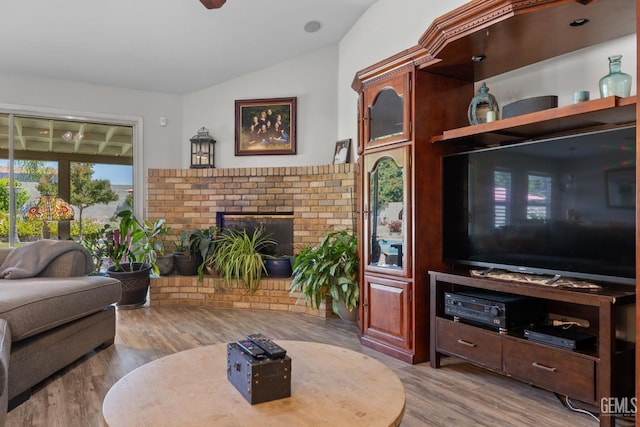5512 Sicily Ct, Bakersfield, CA 93308 - living area with lofted ceiling, wood finished floors, and a fireplace