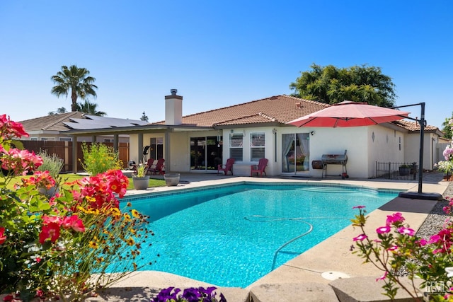5512 Sicily Ct, Bakersfield, CA 93308 - view of swimming pool with fence, a patio area, and area for grilling