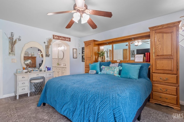 5512 Sicily Ct, Bakersfield, CA 93308 - bedroom with a ceiling fan, connected bathroom, and baseboards