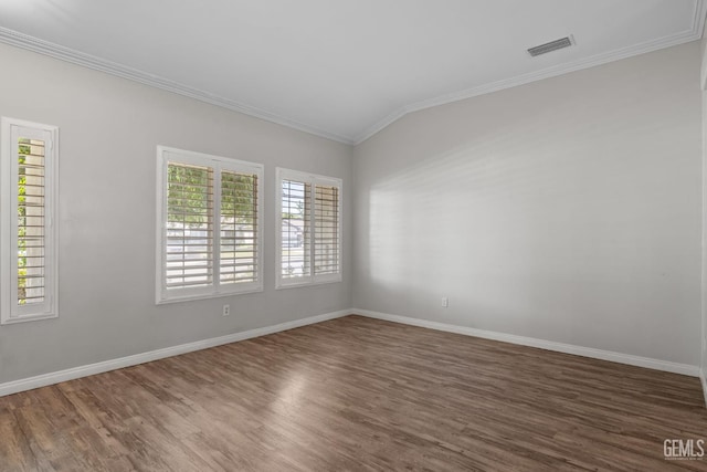5512 Sicily Ct, Bakersfield, CA 93308 - empty room with wood finished floors, ornamental molding, baseboards, and vaulted ceiling