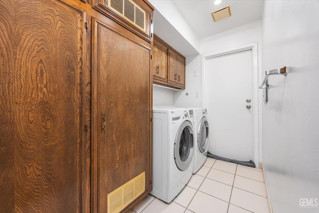 5600 Kirkside Dr Unit F, Bakersfield, CA 93311 - laundry area with cabinet space, washing machine and clothes dryer, and light tile patterned floors