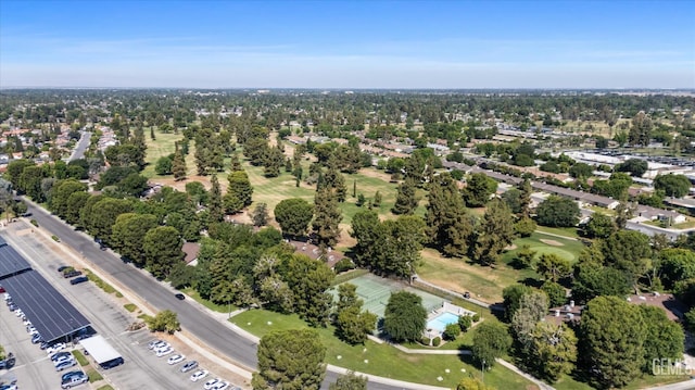 5600 Kirkside Dr Unit F, Bakersfield, CA 93311 - aerial view of property and surrounding area featuring a tree filled landscape