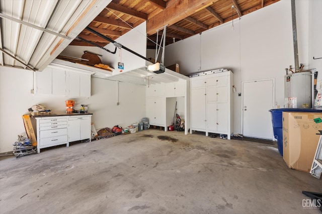5600 Kirkside Dr Unit F, Bakersfield, CA 93311 - garage featuring a garage door opener and gas water heater
