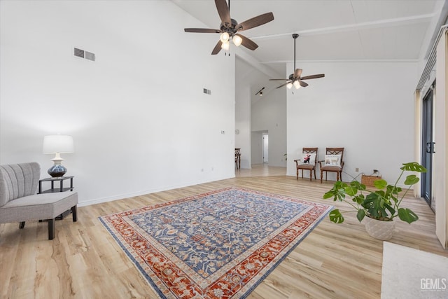 5600 Kirkside Dr Unit F, Bakersfield, CA 93311 - living area with a ceiling fan, high vaulted ceiling, light wood-type flooring, beamed ceiling, and baseboards
