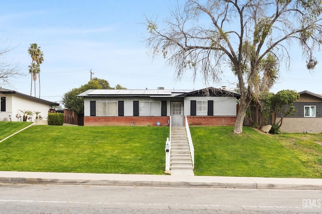 ranch-style house featuring a front lawn