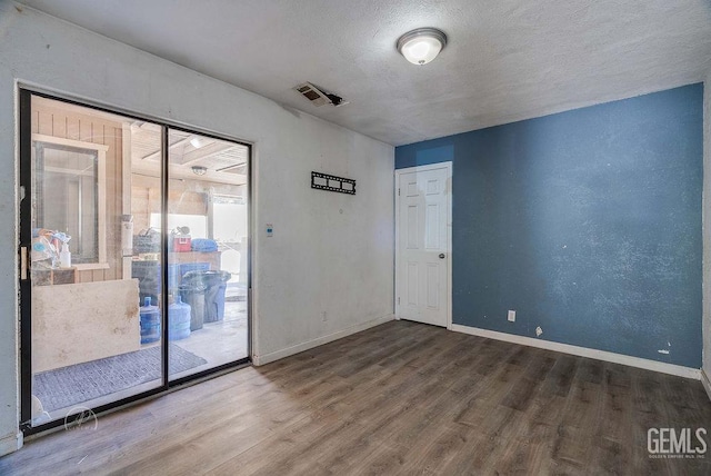 22381 William Tell Trl, Tehachapi, CA 93561 - empty room with wood finished floors and a textured ceiling