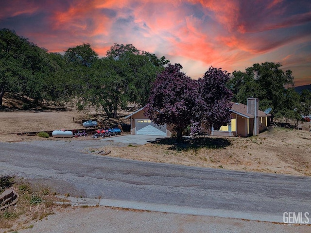 22381 William Tell Trl, Tehachapi, CA 93561 - view of front of house with concrete driveway and a chimney