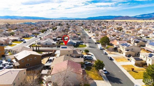 drone / aerial view featuring a residential view and a mountain view