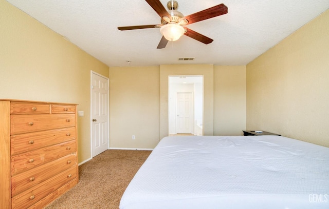 bedroom with ceiling fan, carpet flooring, visible vents, and baseboards