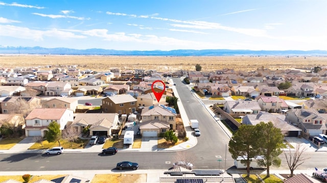 bird's eye view with a residential view and a mountain view