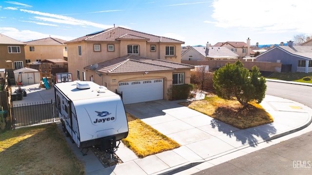 view of front of home featuring fence, a tile roof, driveway, a residential view, and stucco siding