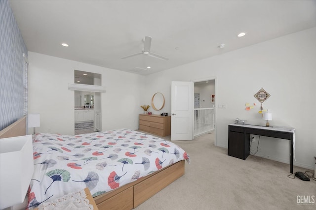 bedroom with recessed lighting, a ceiling fan, ensuite bathroom, and carpet