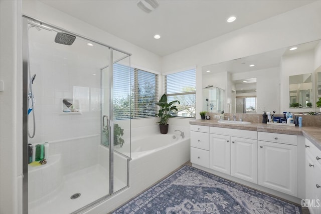 bathroom featuring vanity, visible vents, a shower stall, tile patterned floors, and a bath