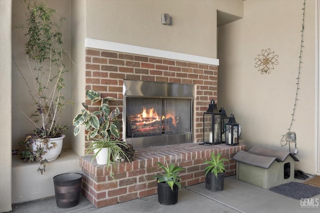 room details with a fireplace and concrete floors