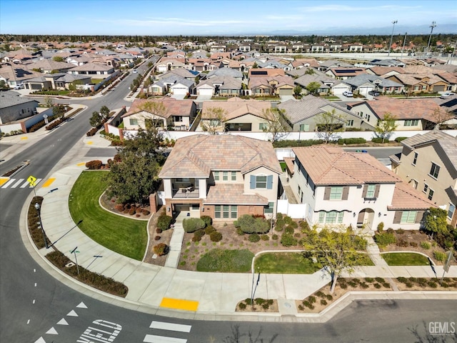 birds eye view of property with a residential view