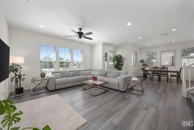 living room with a ceiling fan, recessed lighting, and wood finished floors