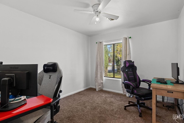 office space featuring a ceiling fan, baseboards, and carpet