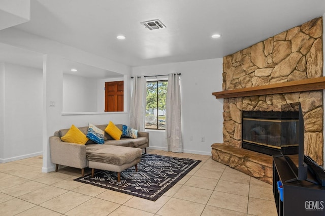 living area with recessed lighting, baseboards, visible vents, and tile patterned flooring