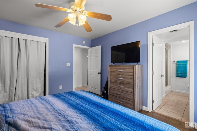 bedroom featuring a ceiling fan, baseboards, and visible vents