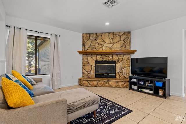 tiled living area with baseboards, a fireplace, recessed lighting, and visible vents