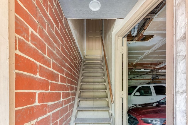 2104 B St, Bakersfield, CA 93301 - staircase featuring brick wall