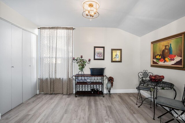 2104 B St, Bakersfield, CA 93301 - sitting room featuring wood finished floors, lofted ceiling, baseboards, and a chandelier