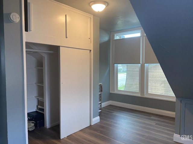 2104 B St, Bakersfield, CA 93301 - unfurnished bedroom featuring dark wood finished floors, baseboards, and a closet