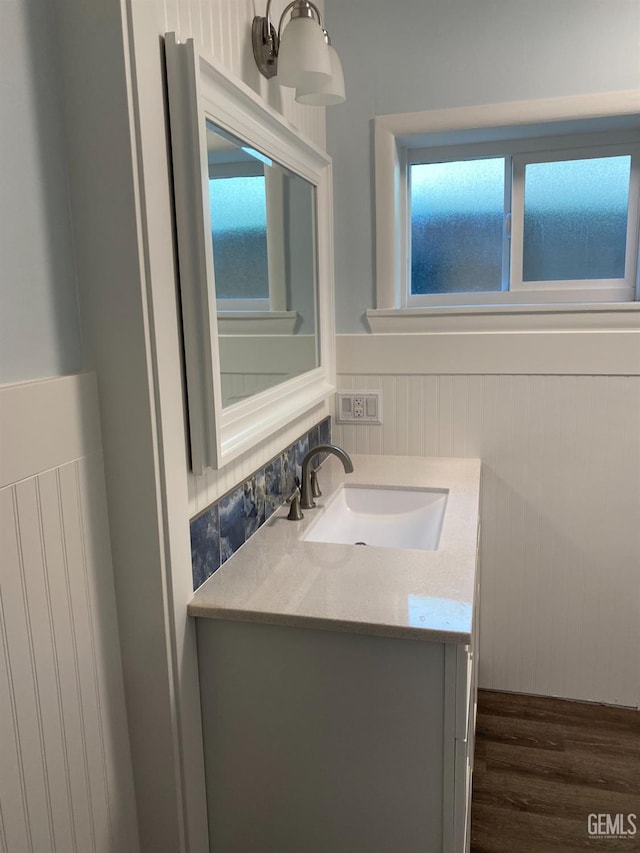2104 B St, Bakersfield, CA 93301 - bathroom featuring vanity, wood finished floors, and wainscoting