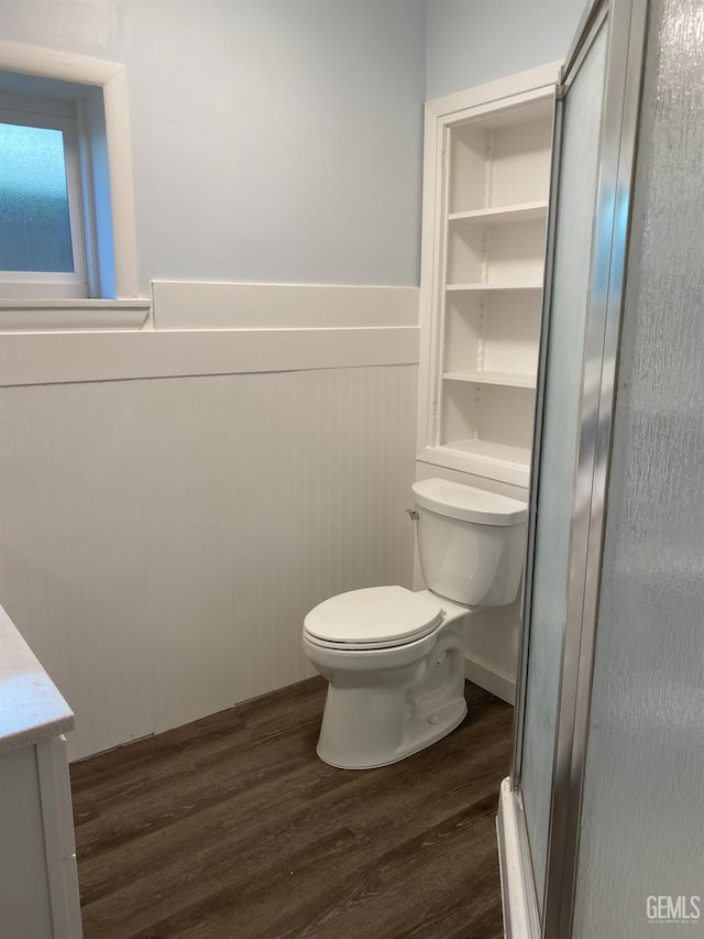 2104 B St, Bakersfield, CA 93301 - bathroom with wood finished floors, toilet, a wainscoted wall, and vanity
