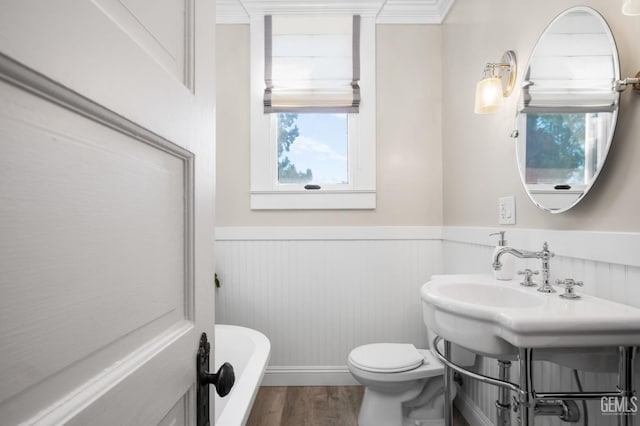 2104 B St, Bakersfield, CA 93301 - bathroom with wainscoting, toilet, and wood finished floors