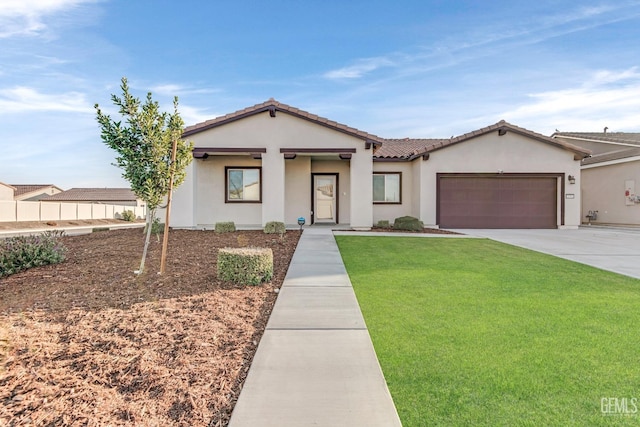 view of front of property featuring a garage and a front lawn