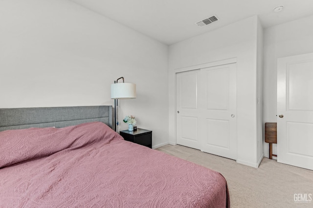 carpeted bedroom featuring a closet