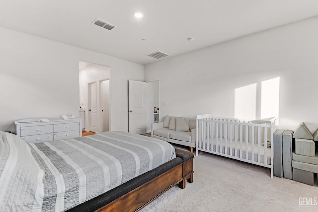 bedroom featuring light colored carpet